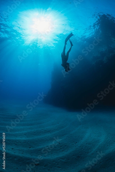 Obraz a girl dives in apnea in Mediterranean sea