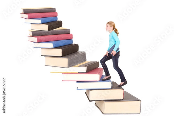 Fototapeta child climbing staircase of books