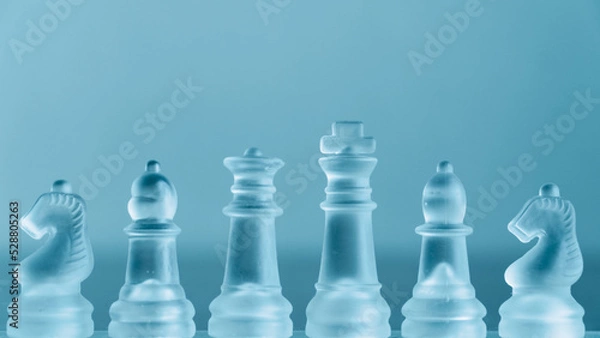 Obraz Chess game. Chess pieces made of glass. Rivalry concept. Selective focus included.
