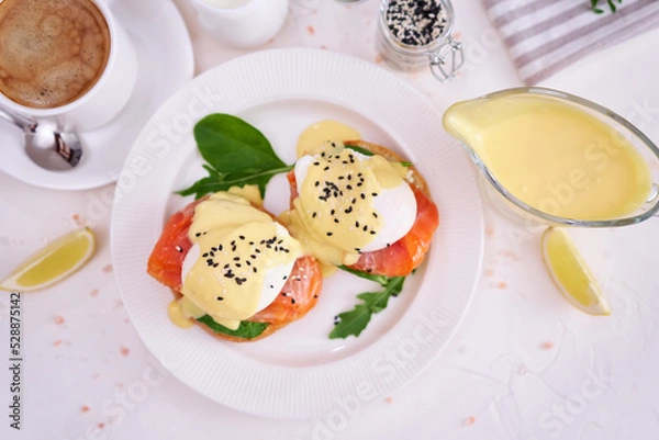 Fototapeta Eggs Benedict with Cream cheese and Smoked salmon on a plate