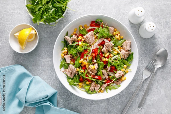 Fototapeta Canned tuna salad with arugula and fresh vegetables, top view