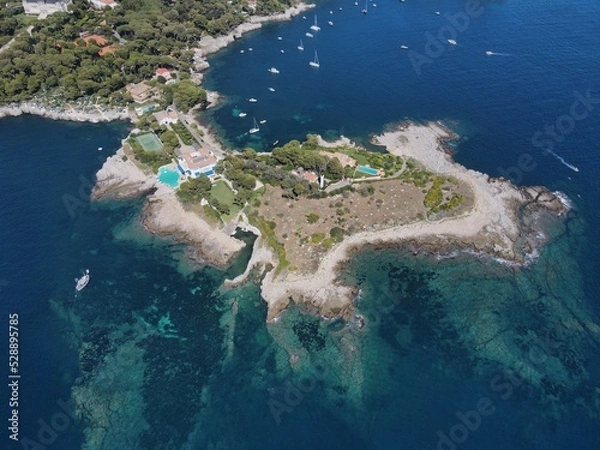 Obraz Aerial view of Cap d'Antibes and  Billionaire's Bay. Beautiful rocky beach near coastal path on the Cap d'Antibes, Antibes, France. Drone view from above of Côte d’Azur near Juan-les-Pins and Cannes.