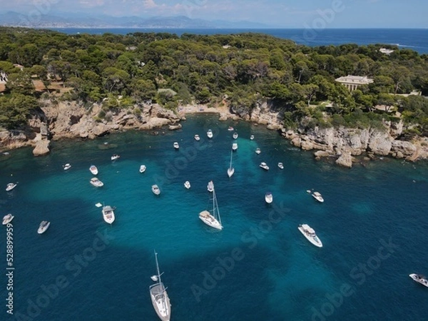 Obraz Aerial view of Cap d'Antibes and  Billionaire's Bay. Beautiful rocky beach near coastal path on the Cap d'Antibes, Antibes, France. Drone view from above of Côte d’Azur near Juan-les-Pins and Cannes.