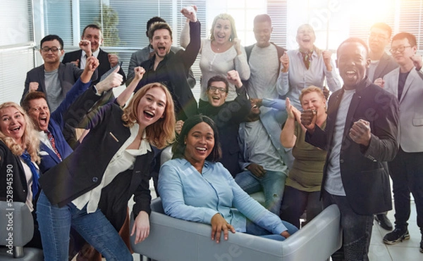 Obraz happy team of diverse corporate employees in the office lobby.