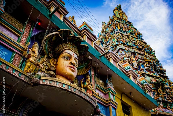 Obraz Closeup of the Beautiful Face of the South Indian Hindu Goddess of Rain, Mariamman, with Ganesh on Her Right, on the Exterior of the Sree Dandu Mariamman Temple in Bengaluru, India