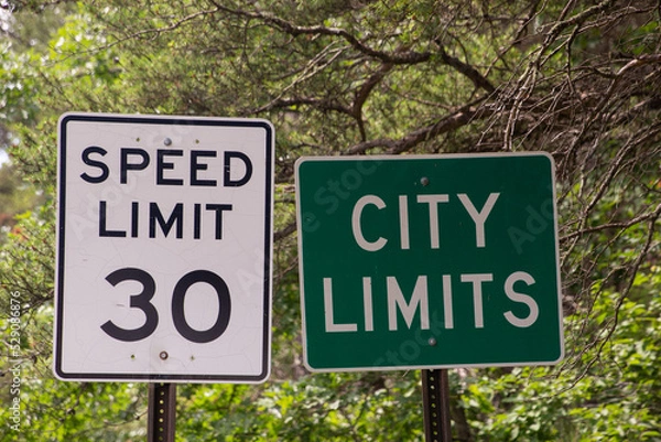 Fototapeta City limits and speed limit road signs 