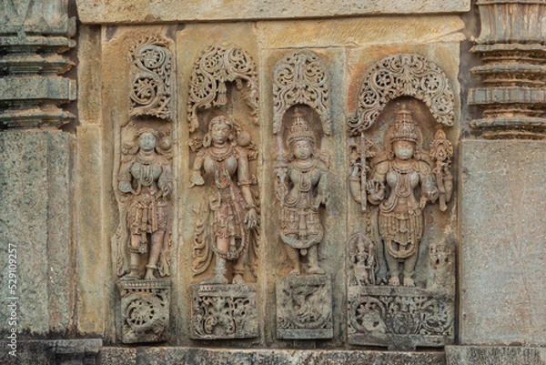 Fototapeta Depicting of  Hindu God and Goddess on the Chennakeshawa Temple, Belur,  It was commissioned by King Vishnuvardhana in 1117 CE, Hassan, Karnataka, India.