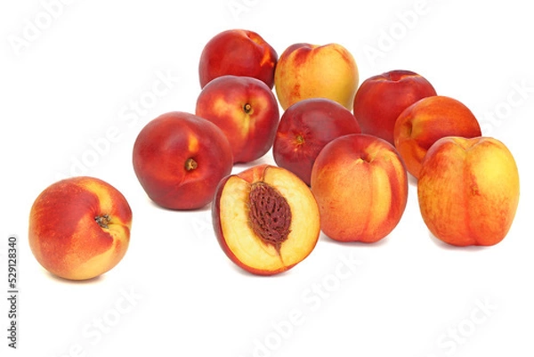Fototapeta Scattered nectarines isolated on white background