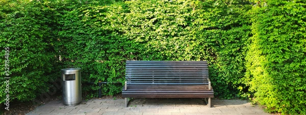 Fototapeta Wooden empty bench in the park