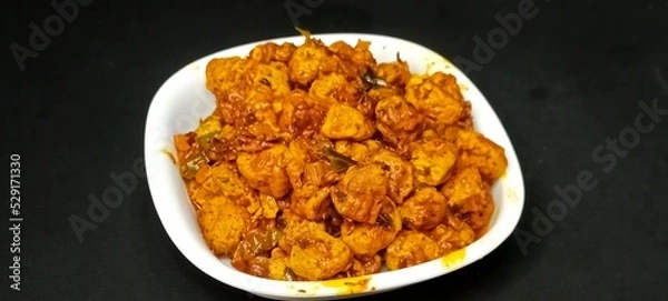Fototapeta Masala Soya Chunk Curry made using Soyabean nuggets and spices - protein rich food from India