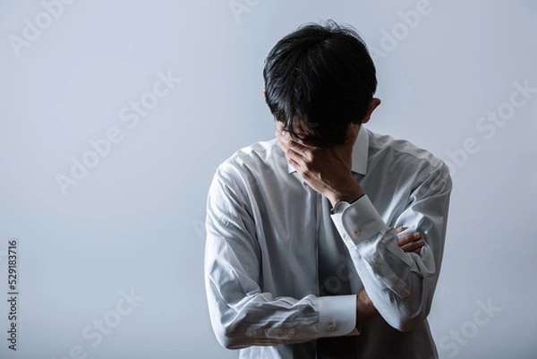 Obraz 落ち込むビジネスマン