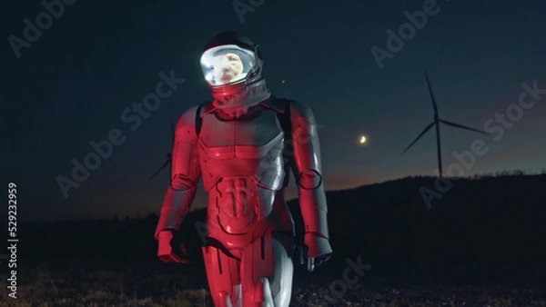 Obraz Hi-tech robot engineer on windmill farm checking the process looking around at night. Future technology innovation. Workflow automation. Human lifestyle. Ecology protection. Nature wind energy.