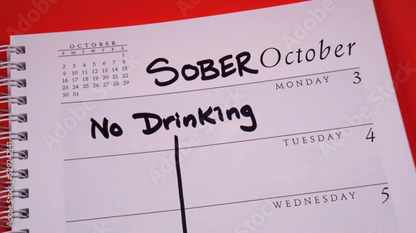 Obraz Sober October marked on a 2022 calendar. Sober October is the new and more poetic Dry January. It involves cutting out alcohol for 31 days, often for charity.
