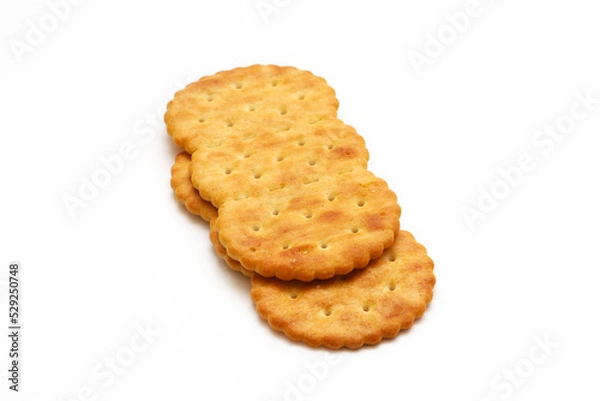 Fototapeta Oval crackers on a white background. Close-up