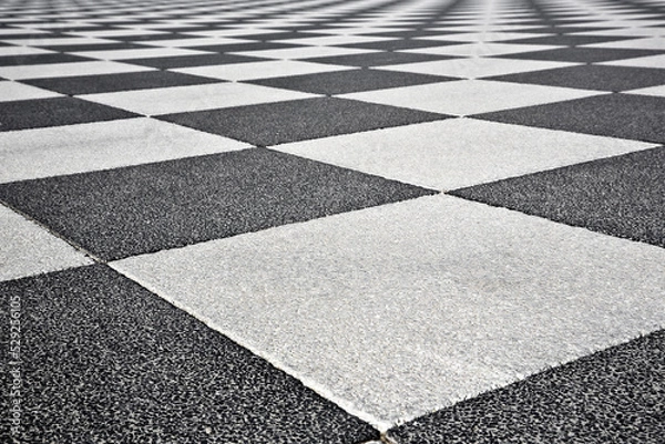Fototapeta Detail of the pavement of the famous Mascagni square in Livorno with the particular chessboard design (Tuscan-Italy)