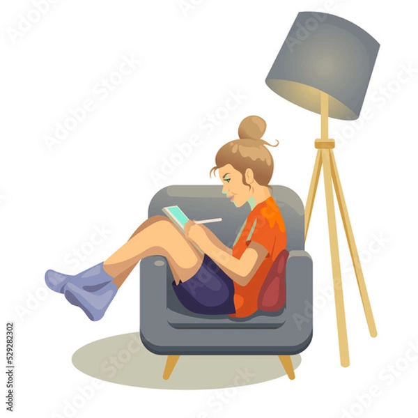 Obraz A girl draws on a tablet in a chair