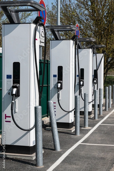 Obraz Close up of an electric vehicle charging station on a roadside car park. Vertical picture.