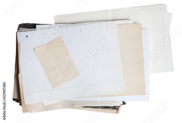 Fototapeta Sheet of square paper on pile of aged papers
