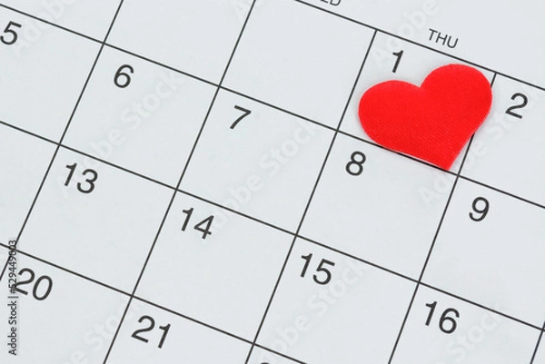 Fototapeta Red heart shape on the date of the 1st day in the calendar.