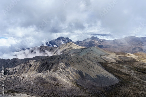 Fototapeta From the pan de azucar peak with an altitude of 4,680 above sea level in the national park sierra de la Culata with a view of two other peaks called pan quemado and pan de sal.