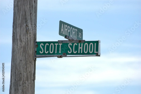 Obraz June 15, 2020. Nettle Creek Township, Illinois, USA. The street signs on a pole at the intersection of  Airport Road and Scott School Road.