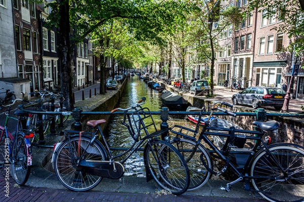 Obraz Amsterdam canal surrounded by bikes
