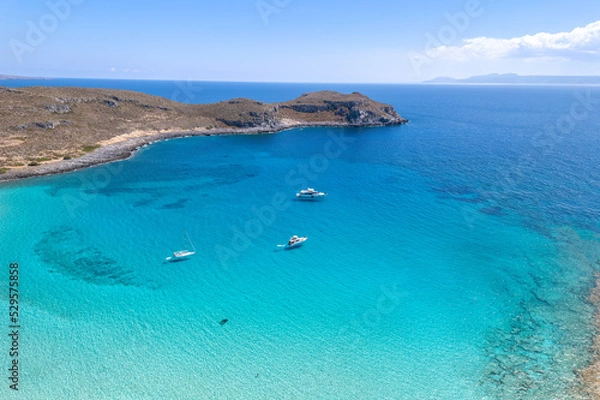 Fototapeta Aerial view of Simos beach in Elafonisos. Located in south  Peloponnese elafonisos is a small island very famous for the paradise sandy  beaches and the turquoise waters.