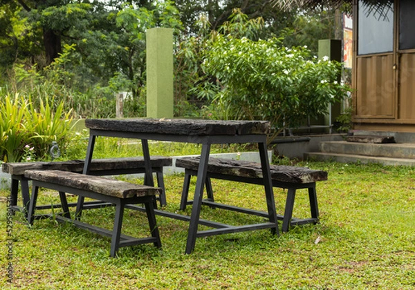 Fototapeta Outdoor chairs, benches and tables made suitable to rough weather and rough use with wrought iron