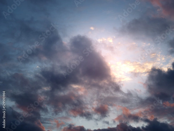 Fototapeta Clouds in the sunset sky.
