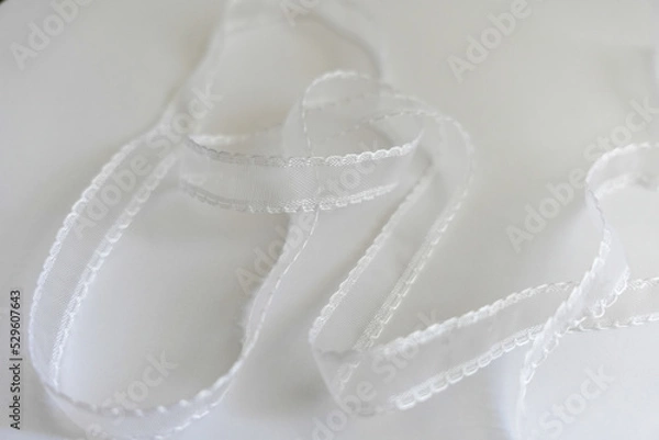 Fototapeta 白いレースリボンのアップ