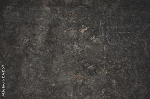 Obraz Darkened concrete surface with stains and scuffs, grungy vintage background close-up, grunge texture.