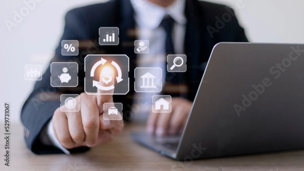 Fototapeta Businessman using a computer to Concept of fund financial investment management portfolio diversification
