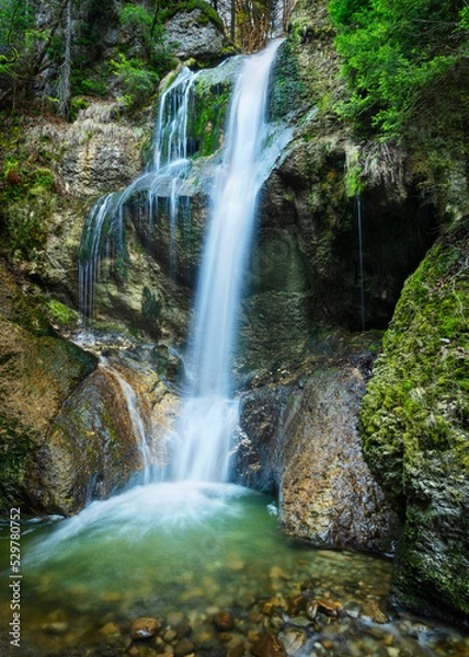 Fototapeta Beautiful little waterfall with rocks and moss. Allgau, Bavaria, Germany