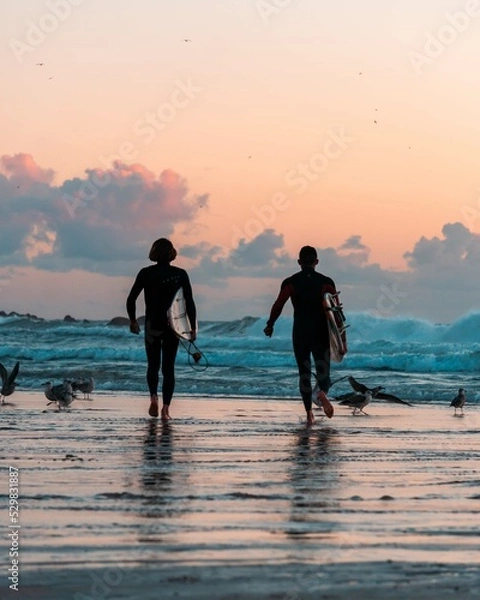 Fototapeta surfers on the beach 