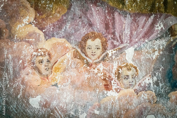 Fototapeta frescoes on the walls of an abandoned temple, angels