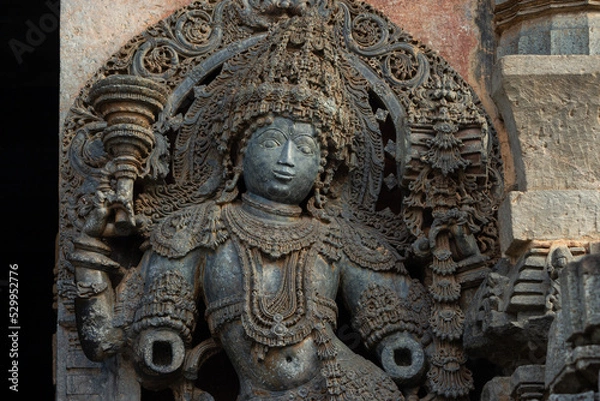 Fototapeta The Sculpture of Doorkeeper of Hoysaleshwara Temple, Beautiful Intricates of Ornaments, Hoysala Temple, Halebeedu, Hassan, Karnataka, India.