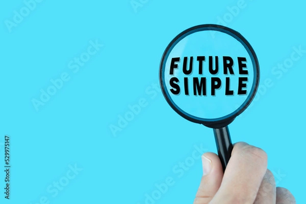 Fototapeta Focused on learning English language. Basic English tenses. Future Simple under magnifying glass. Grammar content for teacher and student.