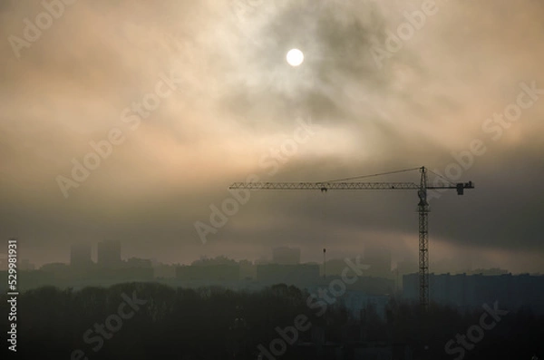 Obraz tower crane building sunset clouds sun city beautiful view