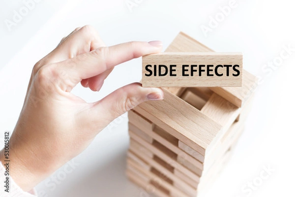 Fototapeta Side effects text on a wooden bar on the background of the table. Medical concept