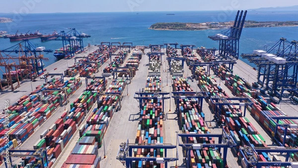 Fototapeta Aerial drone top down photo of colourful containers stacked in Mediterranean container terminal