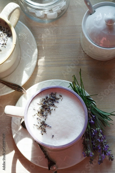 Fototapeta A cup of home made london fog tea latte drink with lavender flower buds, good morning concept, flat lay.