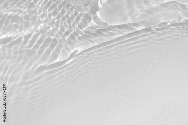 Fototapeta Water texture with wave sun reflections on the water overlay effect for photo or mockup. Organic light gray drop shadow caustic effect with wave refraction of light. Banner with copy space.