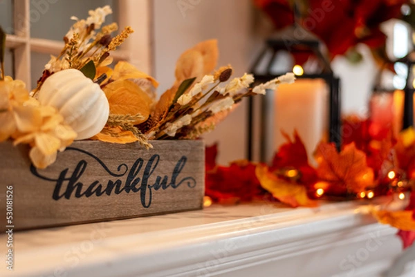 Obraz Fall holiday mantel decorated with colorful leaves and twinkle lights