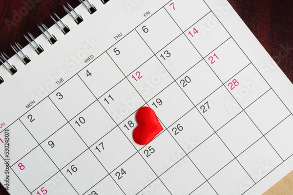 Fototapeta Red heart shape on the date of the 18th day in the calendar.