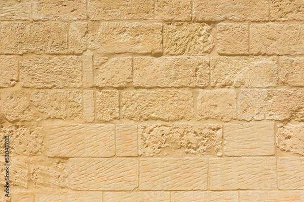 Fototapeta Weathered sandstone brick wall