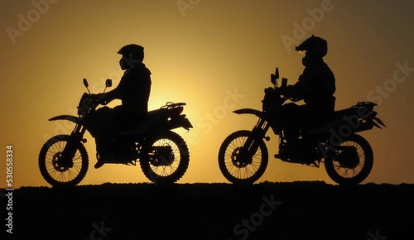 Obraz two motorcycle friends at sunrise