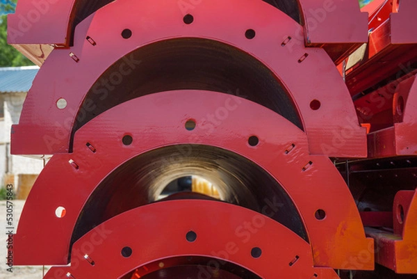 Fototapeta Round column panels stacked in warehouse.