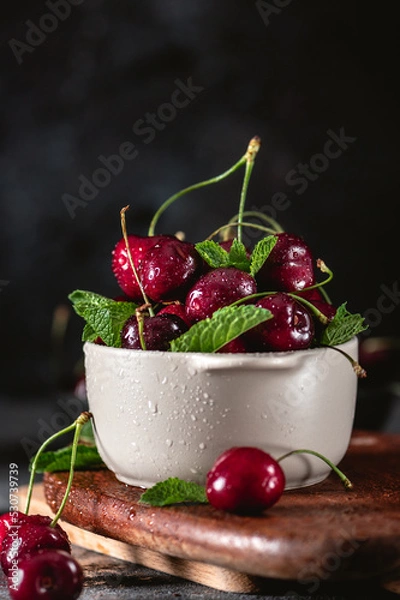 Fototapeta Fresh cherry in close up view on dark background