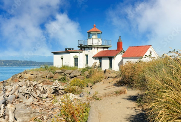 Obraz West Point Light House  also known as the Discovery Park Lighthouse on a sunny day. The lighthouse is an active aid to navigation on Seattle, Washington's West Point.