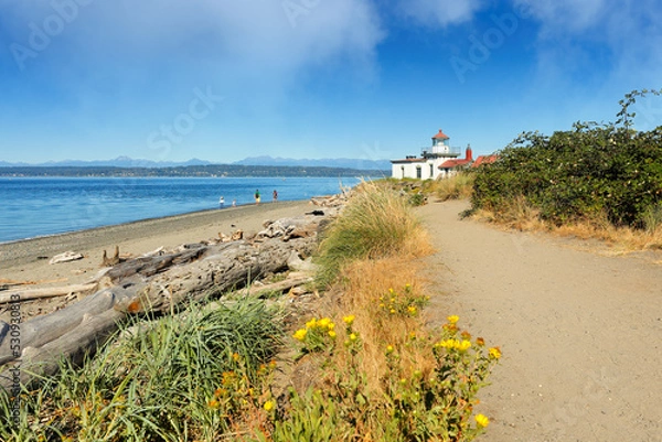 Obraz West Point Light House  also known as the Discovery Park Lighthouse on a sunny day. The lighthouse is an active aid to navigation on Seattle, Washington's West Point.